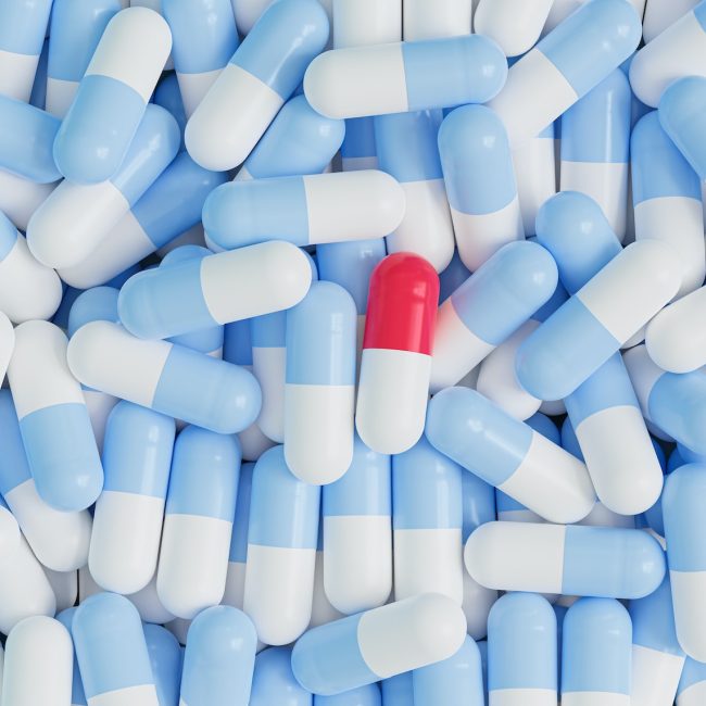 Capsule pills on blue background
